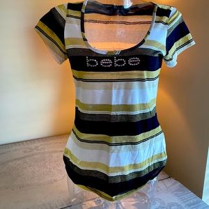 Vintage Bebe in like new condition. Crystal logo, short sleev. Sz L
